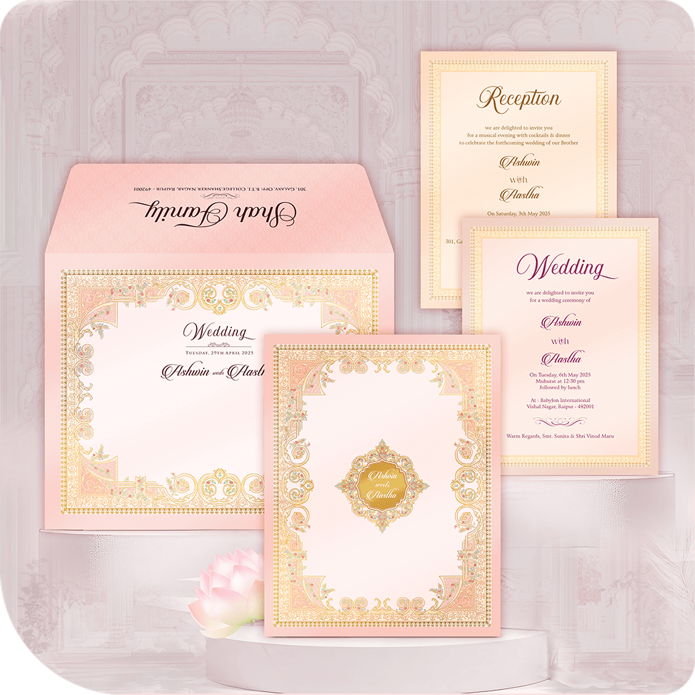 Luxury Gold Filigree Border Wedding Invitation Card with printing. Ornate blush pink Indian folder suite featuring a laser-cut style gold foil lace border. Includes Wedding and Reception insert cards. Premium royal wedding stationery for a grand Hindu ceremony. Designer pocketfold card with full custom printing service.
