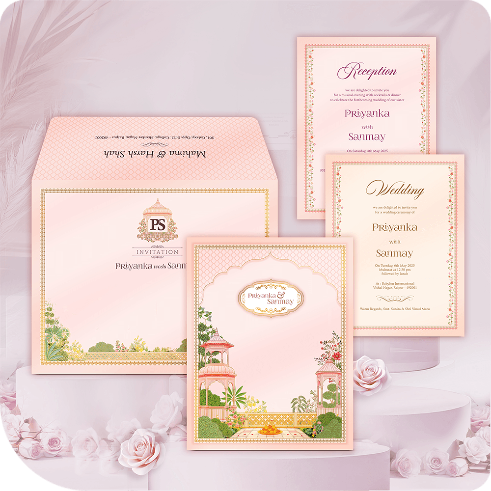 Luxury Haveli Garden Destination Wedding Invitation Card with printing. Pastel pink folder suite featuring traditional Indian palace architecture, arch window, and lush floral illustration. Includes Wedding and Reception insert cards and a monogrammed envelope. Premium royal Indian wedding stationery. Full custom printing service included.
