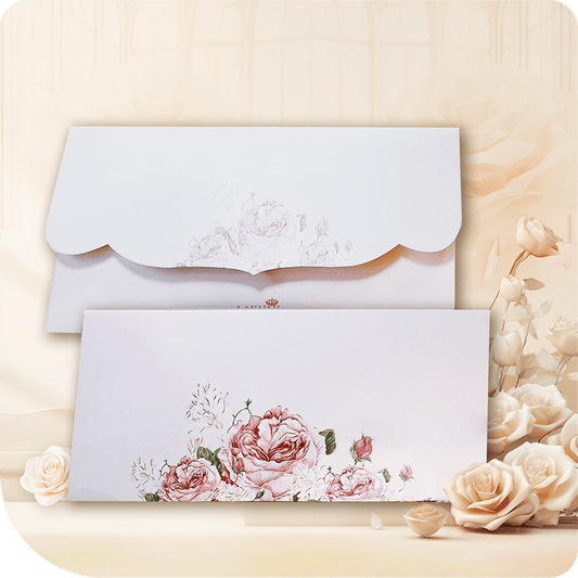 A sophisticated blush envelope adorned with intricately detailed rose artwork, featuring a scalloped flap for an elegant touch perfect for invitations and special occasions.