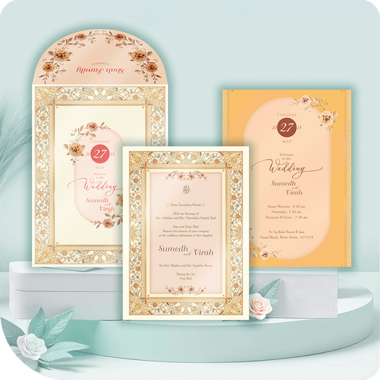 A gracefully designed wedding invitation featuring delicate floral karigari and gold detailing, exuding timeless elegance and cultural charm.
