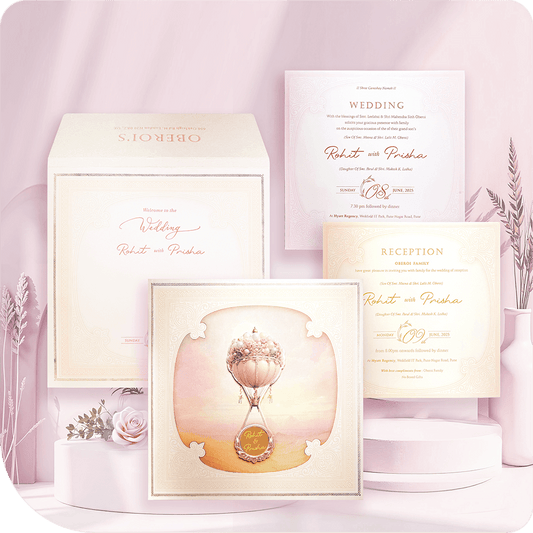 Hot air balloon wedding invitation with a floating-on-air design, acrylic mirror, and pastel shades in a luxury folder style with two premium inserts.