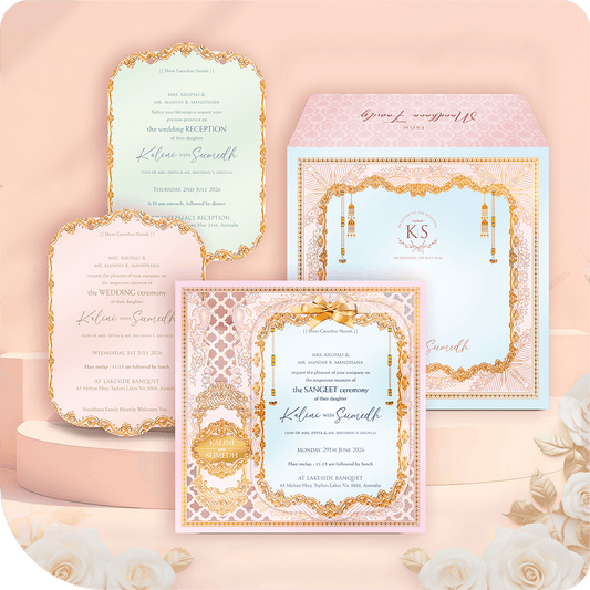 A luxury MDF wedding invitation suite with printing featuring pastel pink, blue, and green inserts with ornate gold foil borders, displayed with a matching designer envelope on a floral background.