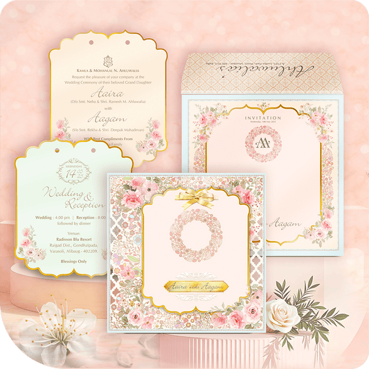 Collection of wedding invitations with floral designs on a soft pink background.