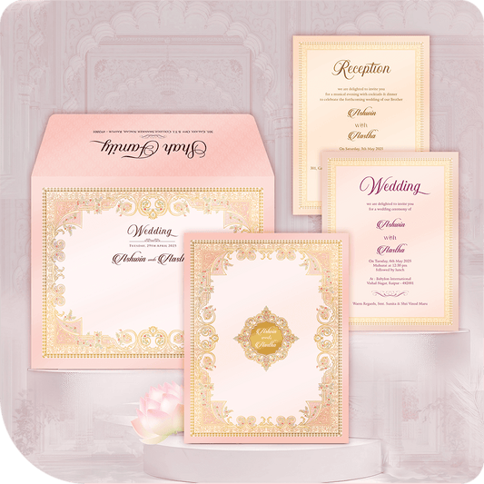 Luxury Gold Filigree Border Wedding Invitation Card with printing. Ornate blush pink Indian folder suite featuring a laser-cut style gold foil lace border. Includes Wedding and Reception insert cards. Premium royal wedding stationery for a grand Hindu ceremony. Designer pocketfold card with full custom printing service.