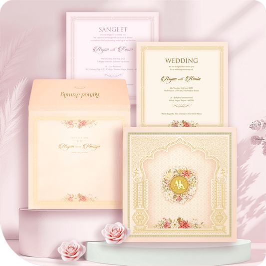 Premium imported paper wedding invitation, gleaming golden acrylic mirror nameplate, opulent floral monogram wreath, archway frame, two-leaflet luxury South Asian wedding card suite.