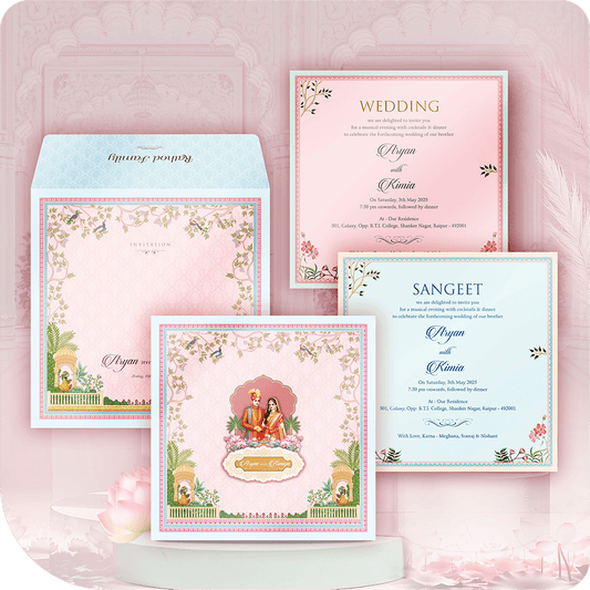 Premium imported paper wedding invitation, golden acrylic mirror nameplate, traditional couple figure, patio scene foliage, ornamental niche, two-leaflet luxury South indian wedding card suite.